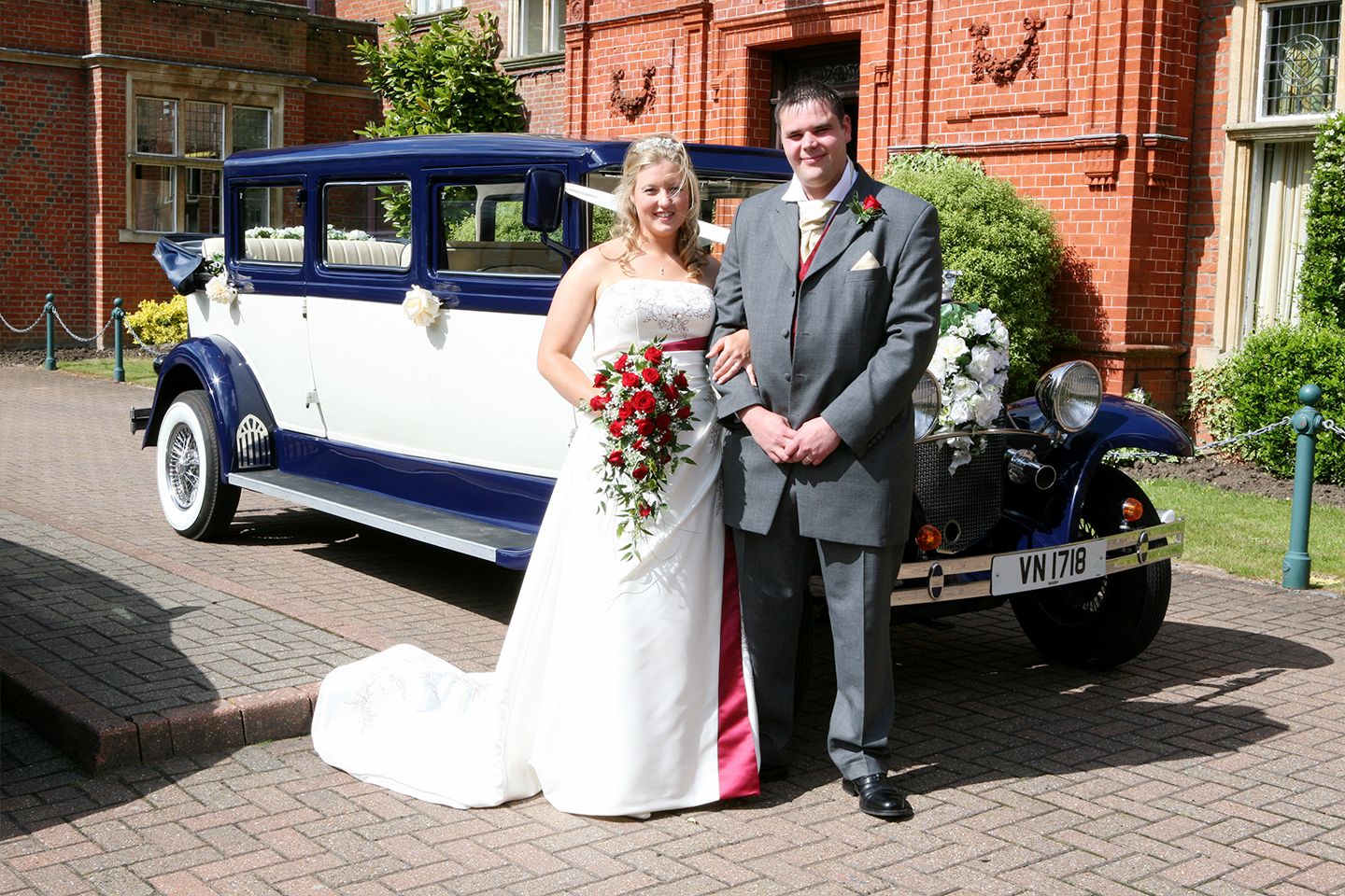 Newlyweds toasting with the roof folded down